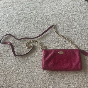 Hot pink / magenta small coach handbag purse.